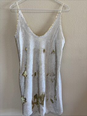 Free People Mini Dress with White and Gold Sequins. subtle white  lace hem